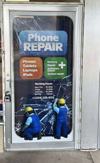 Phone repair shop sign with two workers and a cracked screen effect.