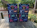 cornhole wraps featuring a neon drinking game design