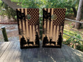 Deer hunter American flag cornhole wraps featuring a nighttime forest scene with buck silhouette on regulation cornhole boards