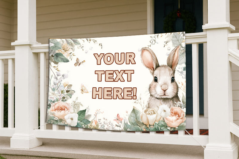 Decorative banner with a rabbit and floral design on a porch